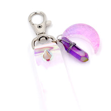 Load image into Gallery viewer, Closeup of pink moon charm attached to keystrap on white background.