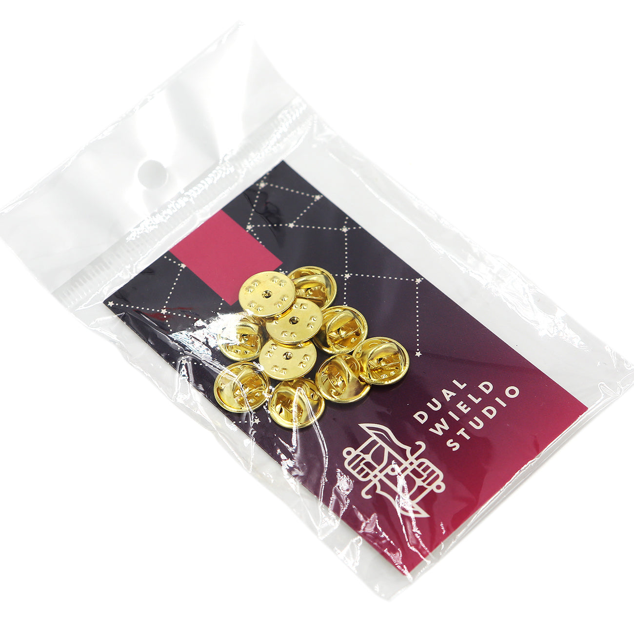 Gold butterfly pin clasps bundled in a small, clear plastic bag with a Dual Wield Studio backing card.