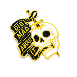 tilted view of Die Mad About It patch on white background.