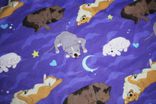 Load image into Gallery viewer, Closeup of purple t-shirt with light purple cloud, light blue crescent moon, light blue heart, and yellow/green star motifs surrounding 4 different sleeping dog breeds..