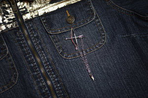 Daine Linked Collar Lapel Pins nested together with the arrow interlocked with the bow on denim jacket.