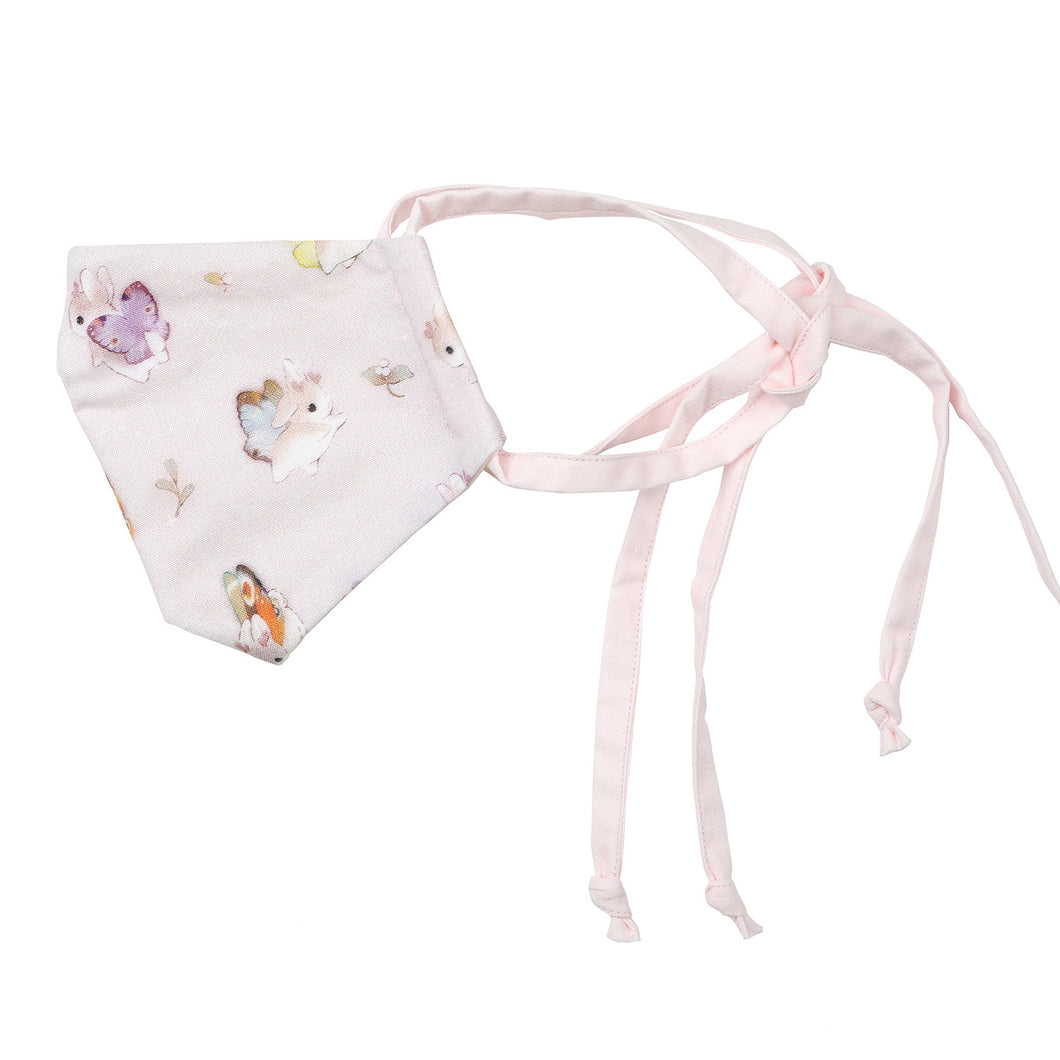 Side view of Pastel pink Bunnerfly mask on white background.