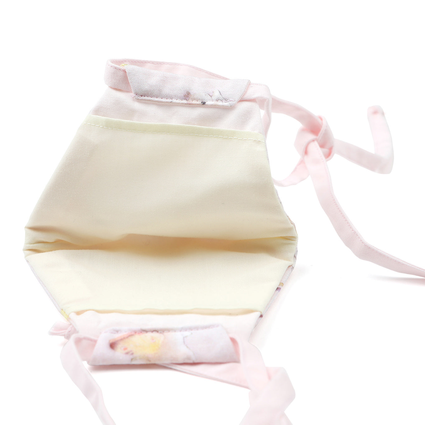 Inside view of Pastel pink Bunnerfly mask on white background.