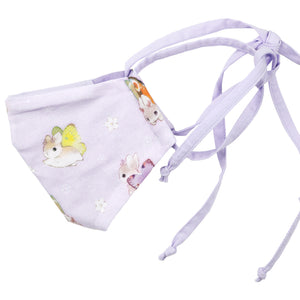 Side view of purple Bunnerfly mask on white background.