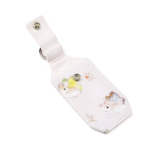 Load image into Gallery viewer, Open pastel pink bunnerfly hand sanitizer holder on white background.