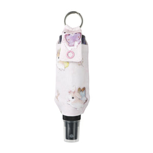 Pastel pink bunnerfly hand sanitizer holder with hand sanitizer bottle inside on white background.
