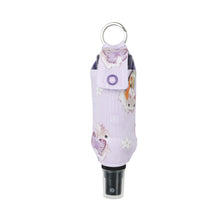 Load image into Gallery viewer, Purple bunnerfly hand sanitizer holder with plastic hand sanitizer spray bottle inside on white background.