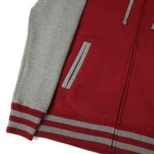 Lower pocket and zipper closeup of Faithful varsity zip up hoodie.