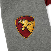 Load image into Gallery viewer, Arm detail of dark red Faithful varsity sweatshirt. Decal is roaring golden yellow lioness in profile framed by marigold and red shield shape.