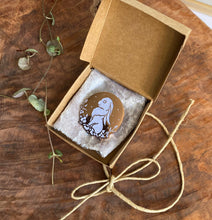 Load image into Gallery viewer, Moon Rabbit pin in brown jewelry box with white cloth.
