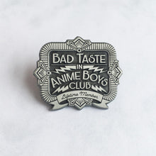 Load image into Gallery viewer, Front view of bad taste antique silver pin on white background.