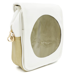 Side view of the white Sun Ita Bag with golden sun insert.