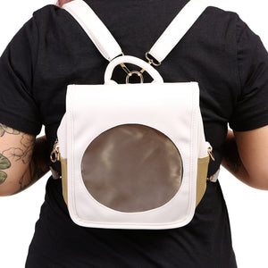 Sun Ita bag worn as a backpack by model with black shirt.