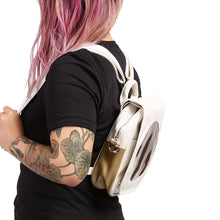 Load image into Gallery viewer, Side view of Sun Ita Bag worn as a backpack on model with black shirt.