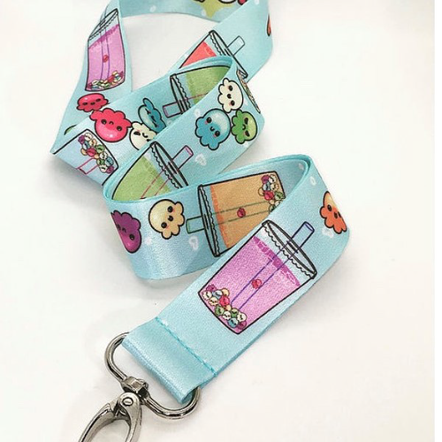 Light blue Boba lanyard with cute, smiling, multicolored octopus creatures. White background.