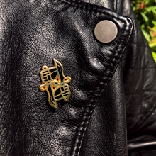 Load image into Gallery viewer, Dual Wield Studio logo lapel pin on black leather jacket lapel.