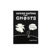 Load image into Gallery viewer, Black and white glow in the dark Spooky Peter Pin Set on their backing card, which depicts a simplified black and white table and wine glass with Speed Dating for Ghosts logo.