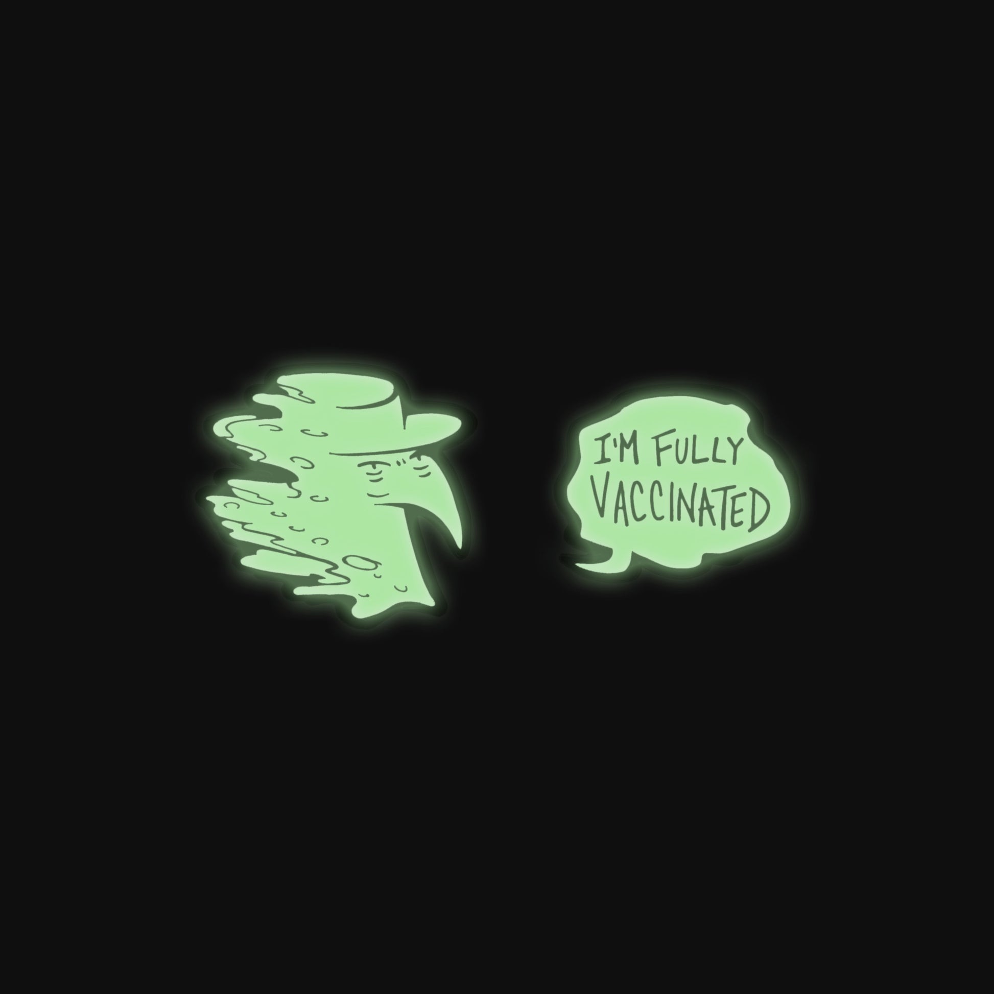 Both Spooky Peter pins glowing green in the dark!