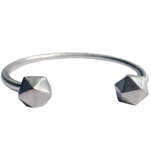 Recycled silver D20 Dice bangle on white background.