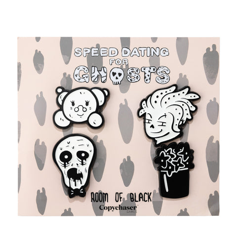 Front view of four black and white Speed Dating for Ghosts glow in the dark enamel pins together on their backing card.