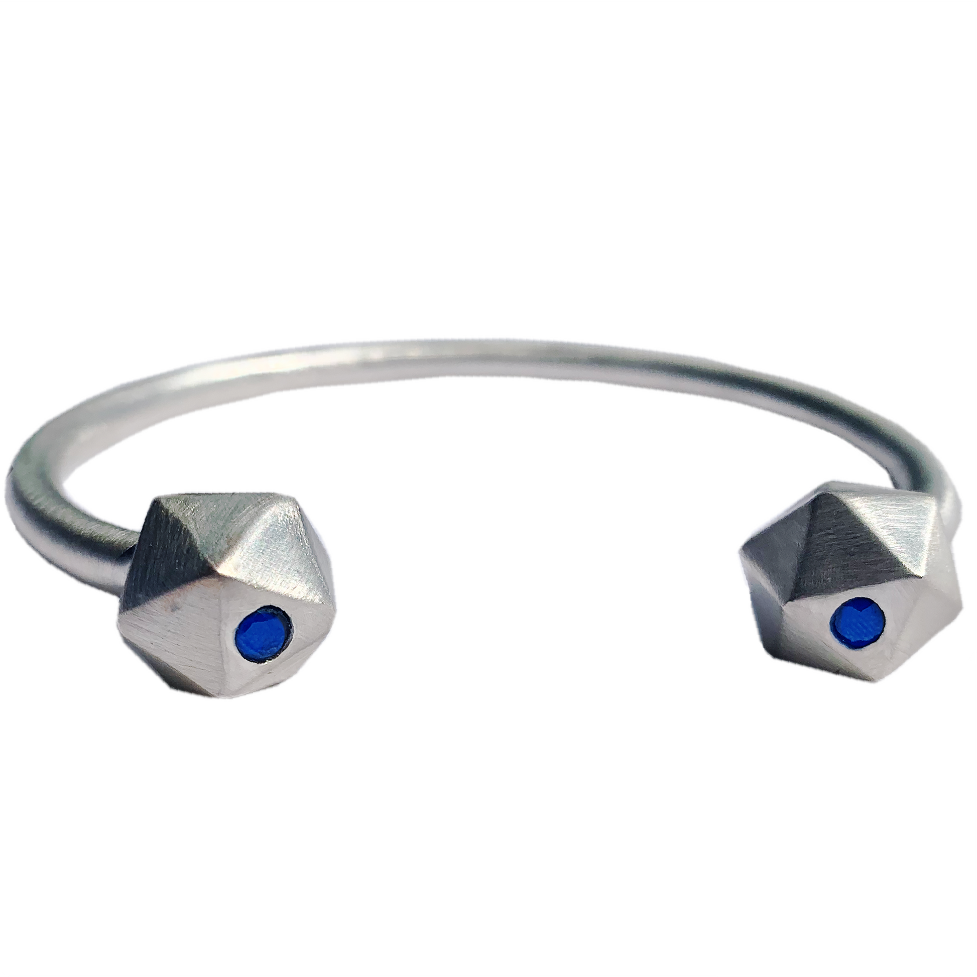 Recycled Silver D20 Dice bangle with sapphire inlay on white background.
