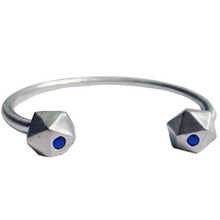 Load image into Gallery viewer, Recycled Silver D20 Dice bangle with sapphire inlay on white background.