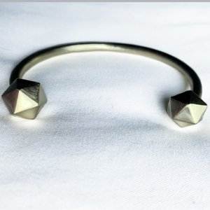 Champagne Satin D20 Dice bangle on white background.
