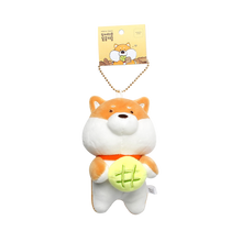 Load image into Gallery viewer, Tan and white shiba with green roll keyring hanging from tag on white background.