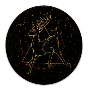 Gold painted deer on black cloth with red embroidered eye and constellation.