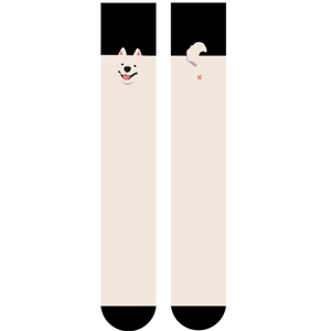 Shin length pair of cream and black socks with dog face and tail/butt details on either side. White background.
