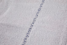 Load image into Gallery viewer, Closeup of white lining, sewn with decorative leafy vine stitch.