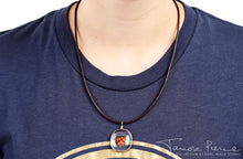 Load image into Gallery viewer, Ember glass necklace with brown cord on model.