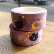 Load image into Gallery viewer, Two rolls of light pink washi tape with gold foil moon and stars and black and white wolves sit on a wooden table.