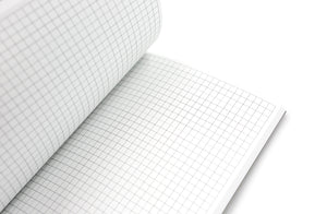 Gridded interior pages of journal on white background.